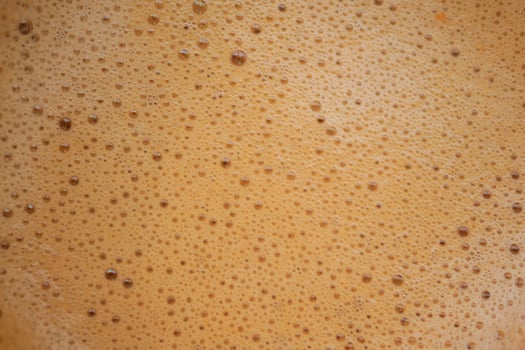 top view of hot coffee with bubble on white background photo