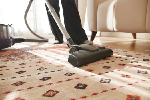 women cleaning with vacuum cleaner carpet, photo