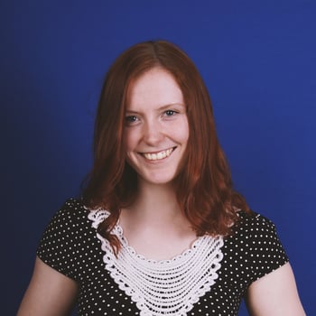 happy young woman with toothy smile photo