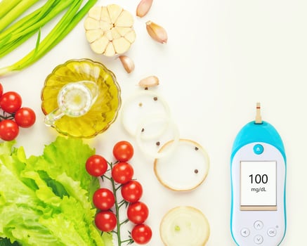 Diabetes diet. Natural vegetables, olive oil and glucometer photo