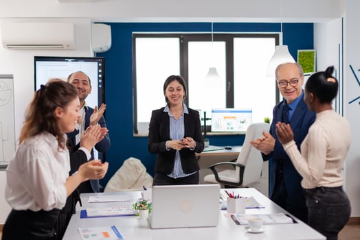Happy creative business team having meeting in broadroom office victory overjoyed. Multiethnical partners coworkers celebrate successful teamwork result at company briefing photo