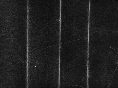 Black paper background. Old wallpaper. Grunge texture photo