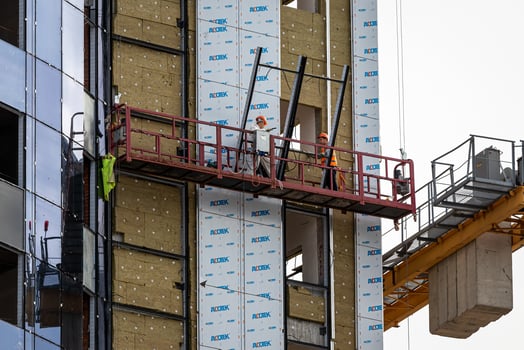 Russia, Kaluga - SEPTEMBER 16, 2020 Builders working on a construction site on a sunny day. photo