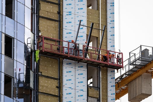 Russia, Kaluga - SEPTEMBER 16, 2020 Builders working on a construction site on a sunny day. photo
