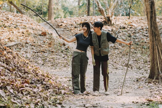 Asian couple sweet in tent inside on they camping trip, traveller relax and sleep togather in out door and camping trip photo