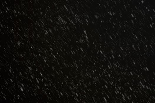 White snow on a black background texture. photo