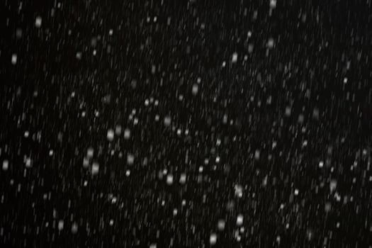 White snow on a black background texture. photo