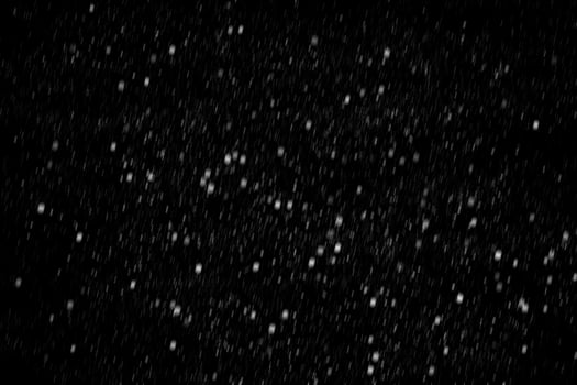 White snow on a black background texture. photo