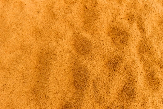 Sandy beach. Detailed sand texture photo