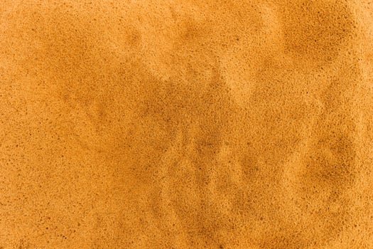 Sandy beach. Detailed sand texture photo