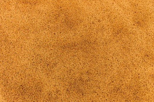 Sandy beach. Detailed sand texture photo