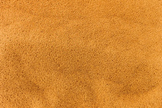 Sandy beach. Detailed sand texture photo