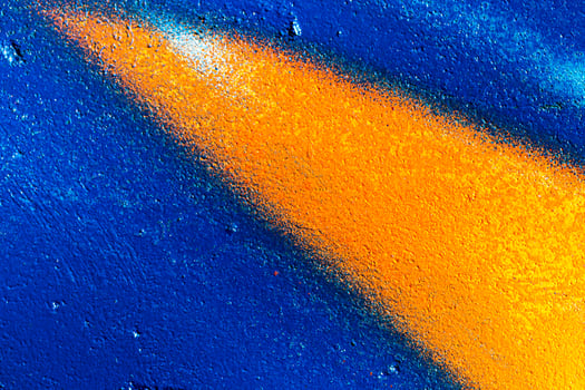 Fragment of colored graffiti painted on a wall. Abstract background for design. photo
