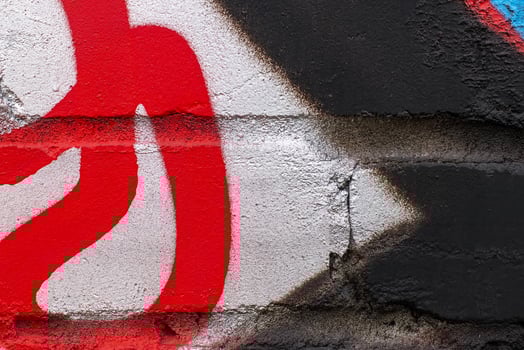 Graffiti painted on a brick wall texture. photo