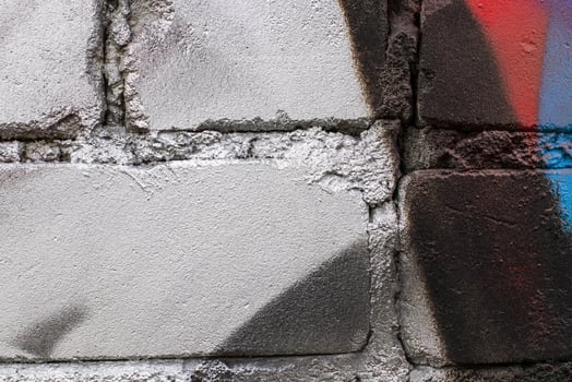 Graffiti painted on a brick wall texture. photo