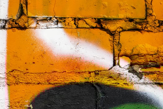 Graffiti painted on a brick wall texture. photo