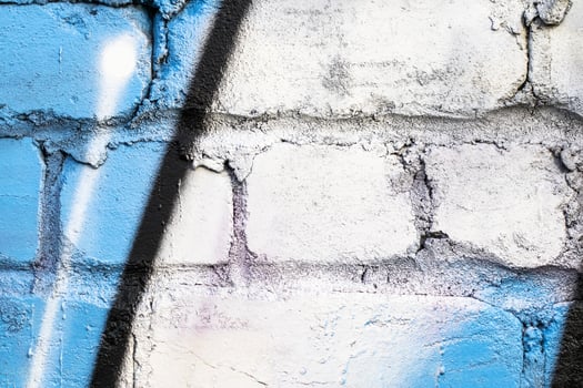 Graffiti painted on a brick wall texture. photo