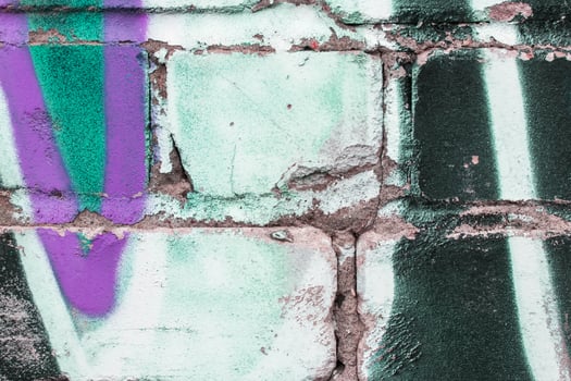 Graffiti painted on a brick wall texture. photo