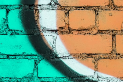 Graffiti painted on a brick wall texture. photo