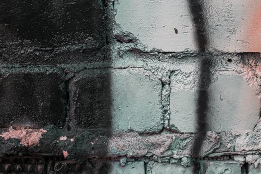 Graffiti painted on a brick wall texture. photo