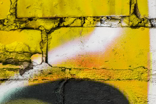 Graffiti painted on a brick wall texture. photo