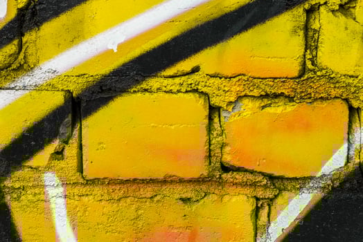 Graffiti painted on a brick wall texture. photo