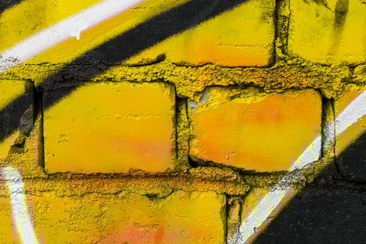 Graffiti painted on a brick wall texture. photo