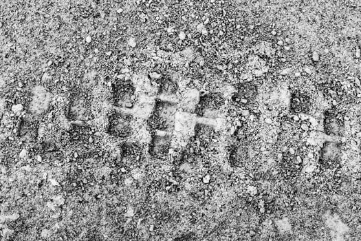 Texture of tire tracks on dry ground. photo