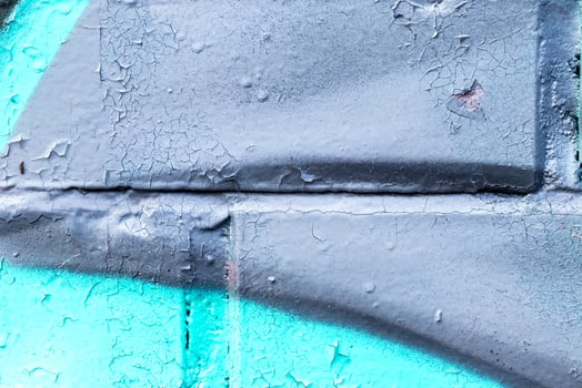Fragment of colored graffiti painted on a brick wall. photo