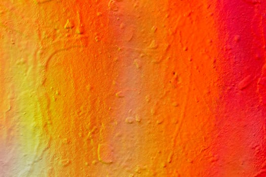 Fragment of colored graffiti painted on a concrete wall. photo