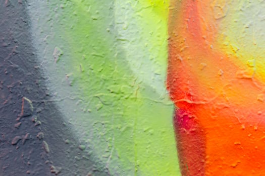 Fragment of bright graffiti painted on a concrete wall. photo
