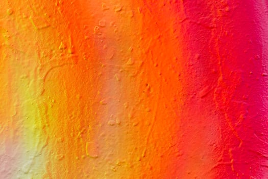 Fragment of bright graffiti painted on a concrete wall. photo