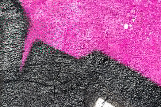 Fragment of colored graffiti painted on a wall. Bright abstract background. photo