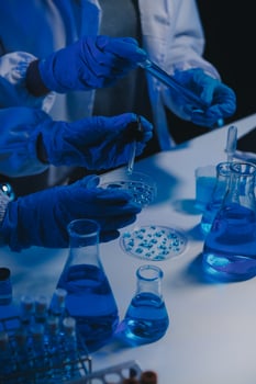 chemist,scientist hand dropping chemical liquid into test tube, science research and development concept photo