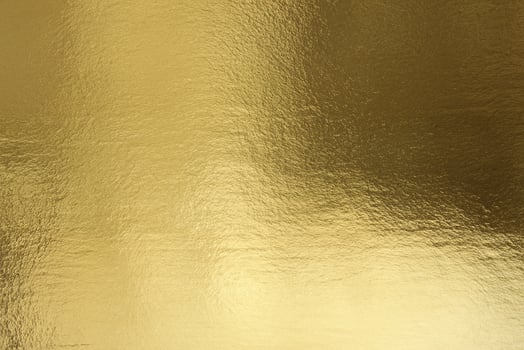 Crumpled Golden Foil Texture, Luxurious Background in Gold photo