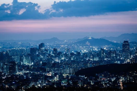 Seoul City skyline and skyscrapers View of Seoul at night in Gangnam District area There is Namsan Mountain in the background, South Korea. photo