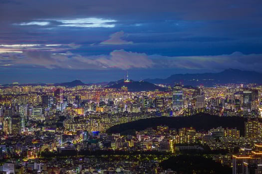 Seoul City skyline and skyscrapers View of Seoul at night in Gangnam District area There is Namsan Mountain in the background, South Korea. photo