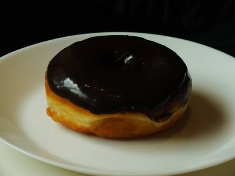 Photo of chocolate donuts cake. National donuts day concept. Douhgnuts cake. Food and beverage image for coffee shop and restaurant business