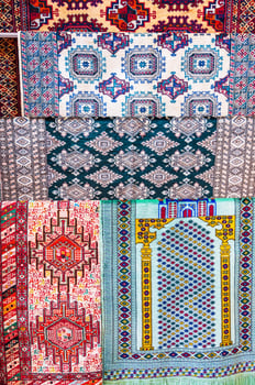 traditional Arab Uzbek carpets at oriental bazaar in Tashkent in Uzbekistan in close-up photo