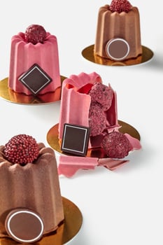 Assorted truffles filled Belgian chocolate shells on gold photo