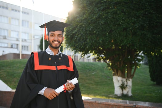 education, graduation and people concept - happy Indian Male graduate student. photo
