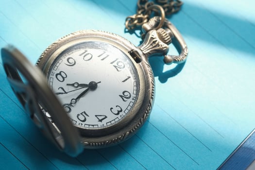 old antique pocket watch showing time, close up photo