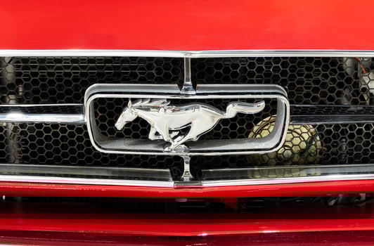 Nonthaburi Thailand 18 May 2024 Close up logo Ford Mustang on red car photo