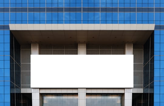 Mock up white horizontal large LED display billboard on entrance office building. Clipping path for mockup photo