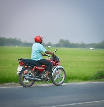 A biker on a road photo