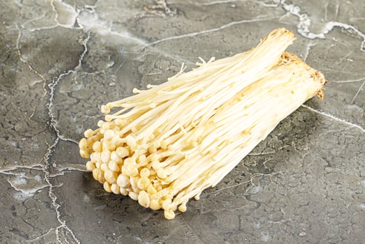 Tasty raw enoki mushroom heap photo