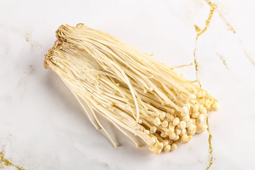 Tasty raw enoki mushroom heap photo