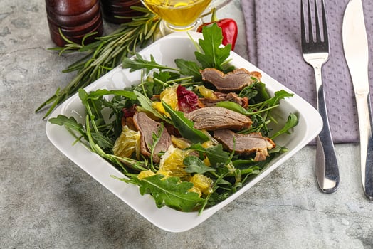 Salad with roasted duck and orange photo