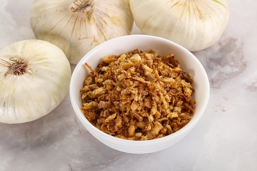 Dried roasted onion flakes for culinary photo