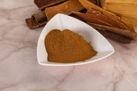 Natural Cinnamon powder with sticks photo